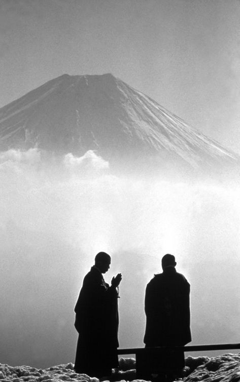 Monks in early morning contemplation before Mount Fuji, Japan, 1961. Photo by Burt Glinn.