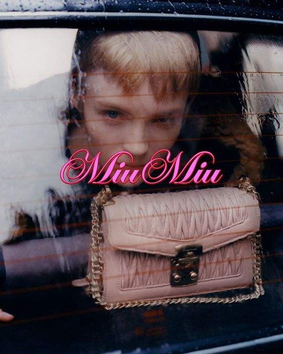 Lucan Gillespie with the Miu Miu Confidential Handbag for a 2019 Miu Miu campaign by Alasdair McLellan.