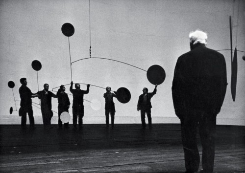 Alexander Calder supervises the installation of his scenery for the ballet Work in Progress, 1968. Photo by Ugo Mulas.