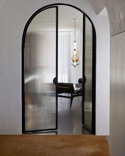 A Pinterest pin added by kaitlinmadio on Jul 11, 2024. The author is Kaitlin Madio. May present: arched glass door, door, arch, interior design, glass.