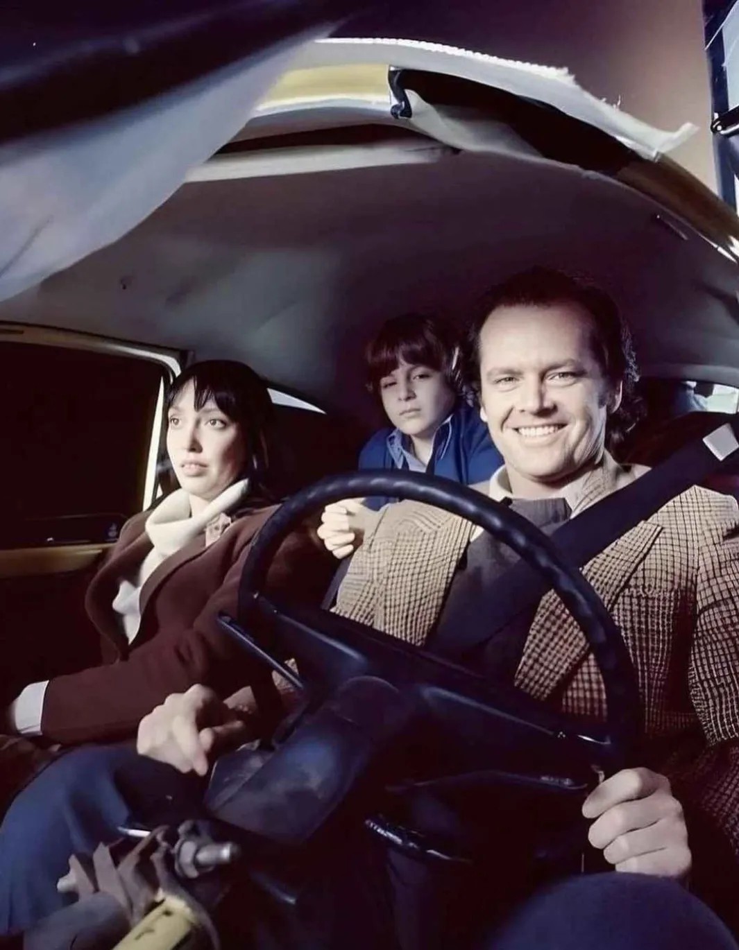 Shelley Duvall, Danny Lloyd, and Jack Nicholson on the set of Stanley Kubrick's film The Shining (1980).