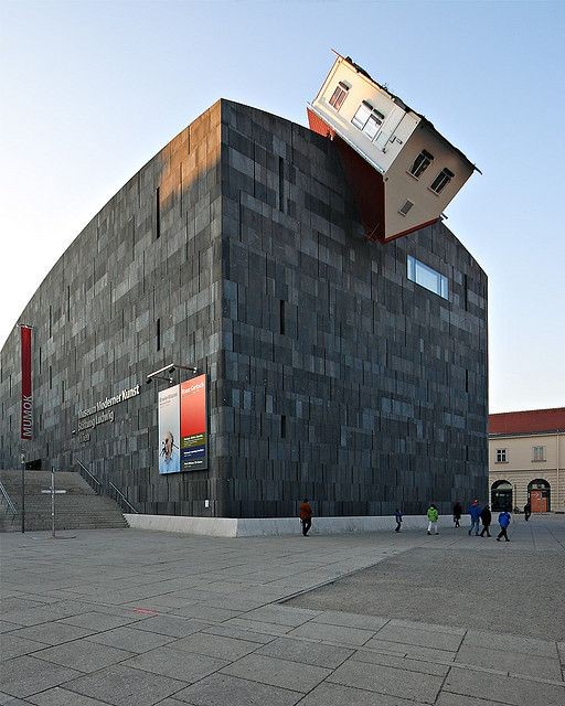 Erwin Wurm's 2006 art installation, House Attack, on the facade of the MUMOK museum in Vienna.