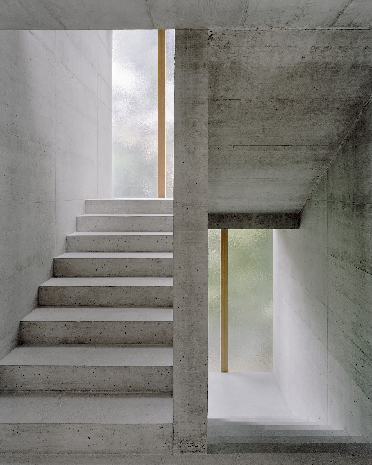The Brutalist interior of Collective Housing Bel-Air by Deschenaux Architects. Photo by Rasmus Norlander.