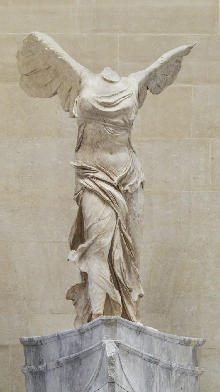 The Winged Victory of Samothrace, a marble sculpture from c. 190 BC, housed at the Louvre Museum.