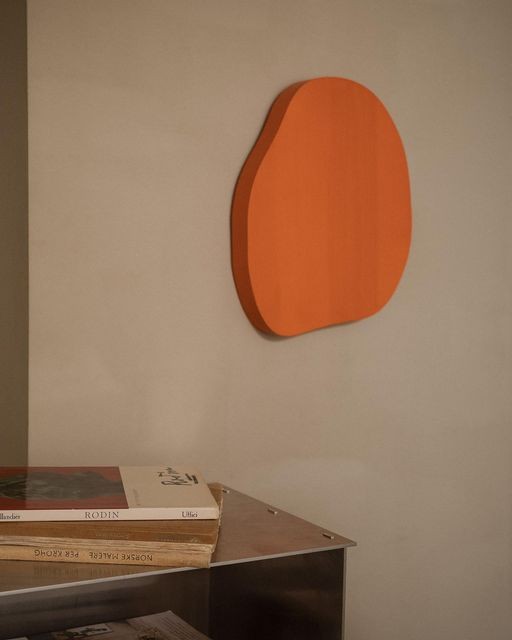 An Instagram  post added on May 14, 2023. The author is @framacph. May present: orange, wood, chair, art, table.