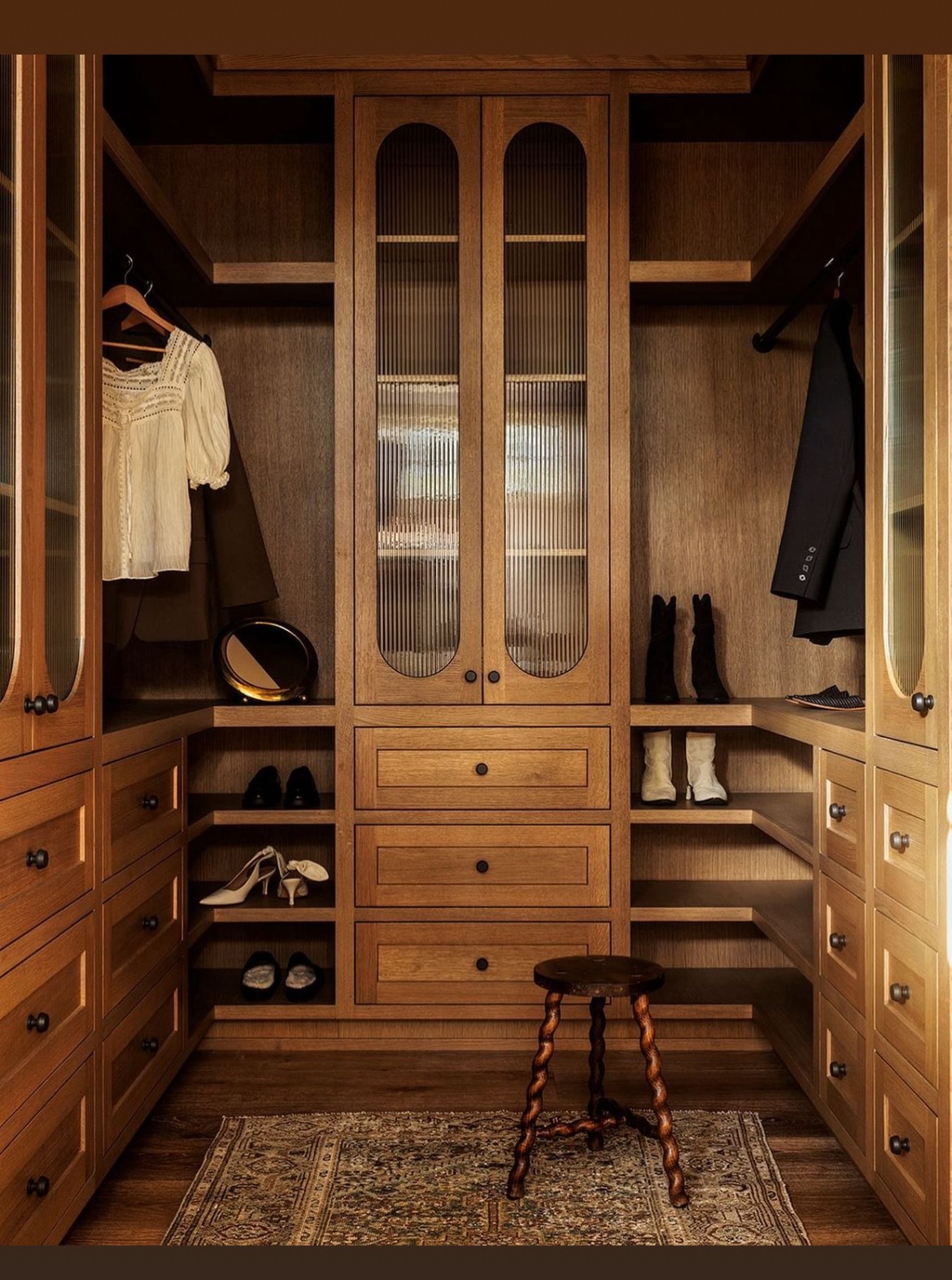 A walk-in closet designed by Light and Dwell.