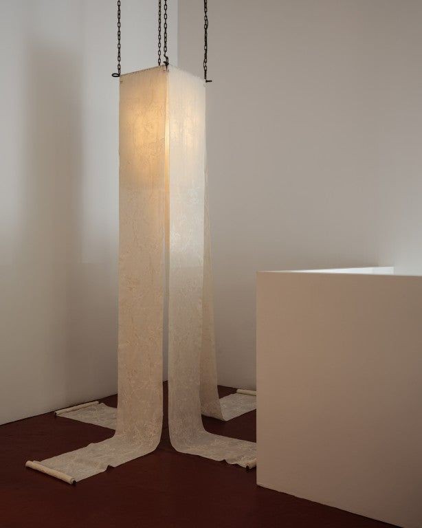 The Mother, a 2024 light sculpture by Known Work, is made from handmade paper scrolls on a steel frame.