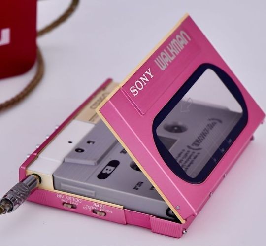 A pink Sony Walkman portable cassette player.