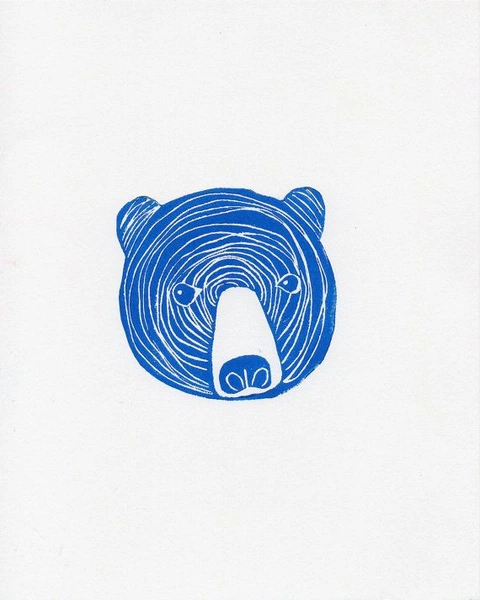 A bear&rsquo;s head as one round blue shape cut in rings, with a pale muzzle.