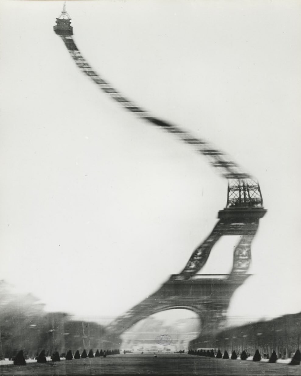 An Instagram  post added on Jan 25, 2024. The author is @hidden.ny. May present: tour eiffel doisneau, eiffel tower, photography, sky, water.