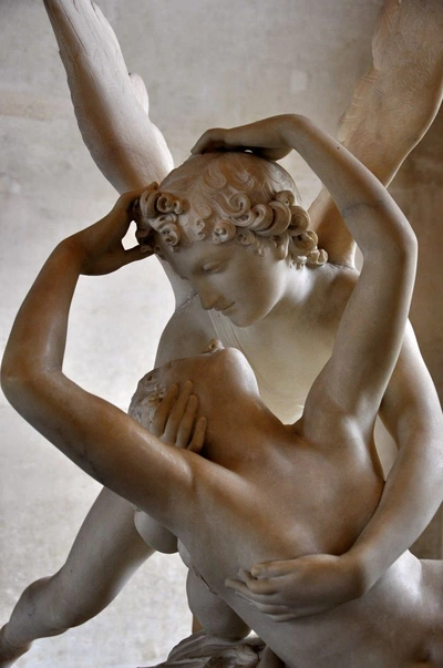A Pinterest pin added by blueowlart on Jan 18, 2025. The author is Blue Owl Art. May present: eros girl, louvre museum, psyche revived by cupid's kiss, cupid and psyche, statue.