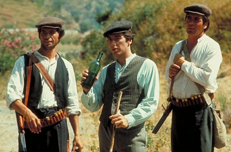 Al Pacino, Franco Citti, and Angelo Infanti in Francis Ford Coppola's The Godfather (1972).