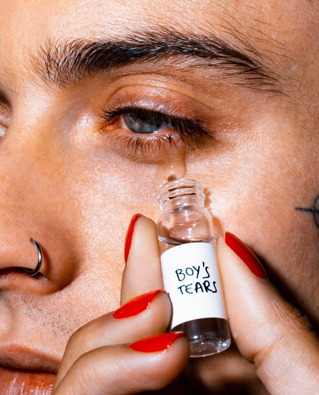 Photograph by Marius Sperlich featuring a vial of Boy's Tears.