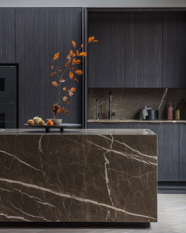 Kitchen by Eggersmann Design with an Armani Brown marble island and brushed spruce cabinetry.
