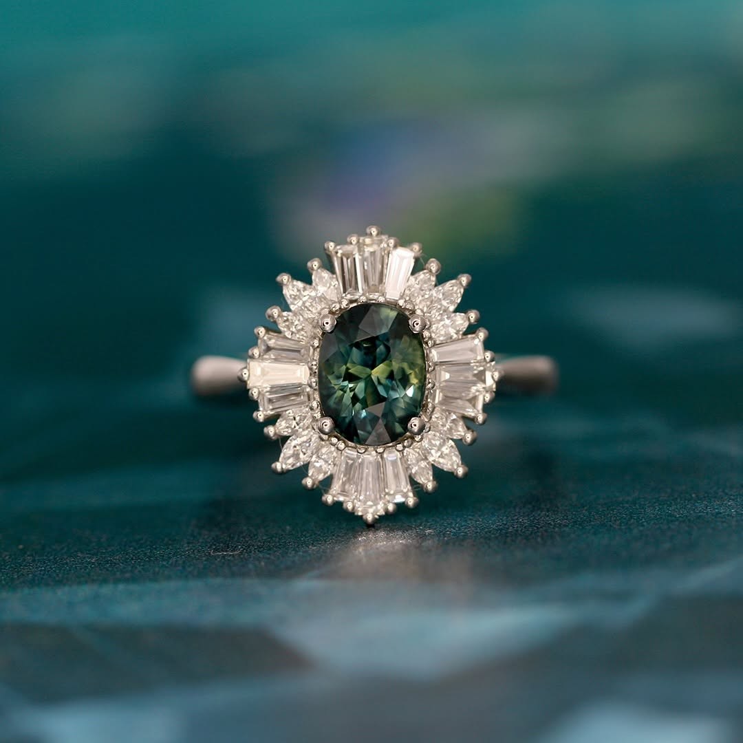 An Art Deco engagement ring with a teal sapphire, commissioned by Melissa & Daryl.