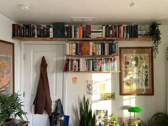 A cover of "Bookshelves" cluster. The owner is evaamaria. The cluster consists of 4 elements.