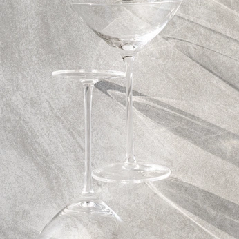A cover of "Art Direction 001" cluster. The owner is kasdikos. The cluster description is "A study in stemware, captured through a lens of cool tones. ". The cluster consists of 20 elements.