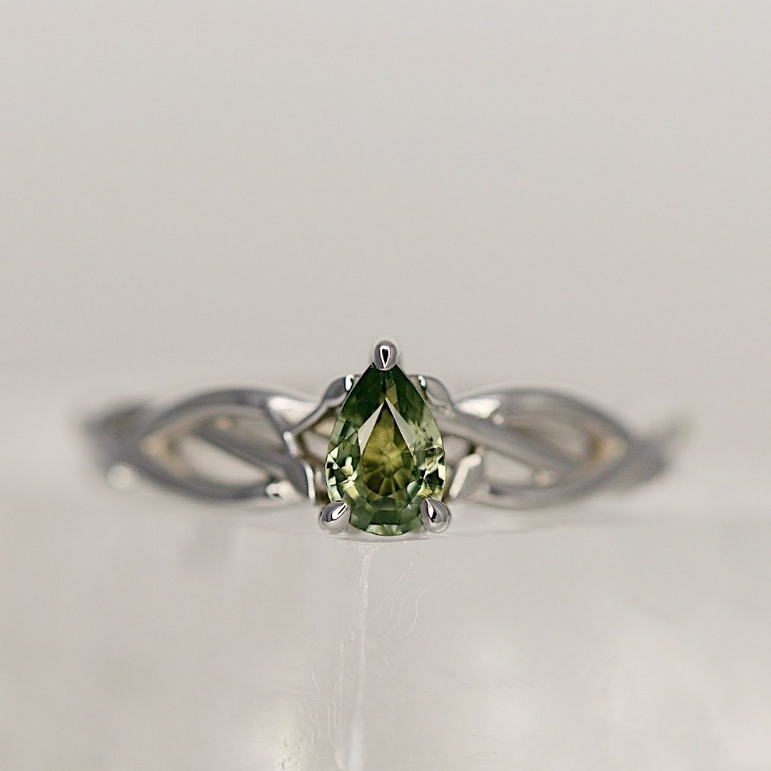 Laura's green sapphire engagement ring, designed by Megan of Saint Teneu.