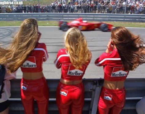 An image added by tyler on Mar 19, 2024. May present: gesture, sports uniform, red, race track, race queen.