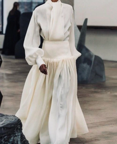 An image added by carolinesoulier on Aug 05, 2024. May present: yasmin warsame, model, fashion show, vogue, fashion.