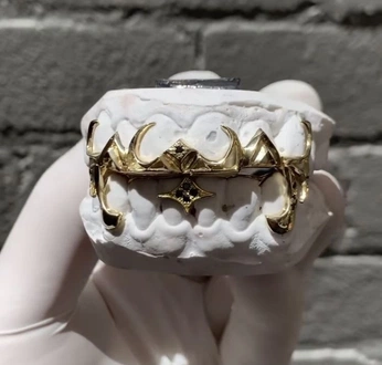 A cover of "GRILLZ" cluster. The owner is godsdivinelight. The cluster consists of 14 elements.