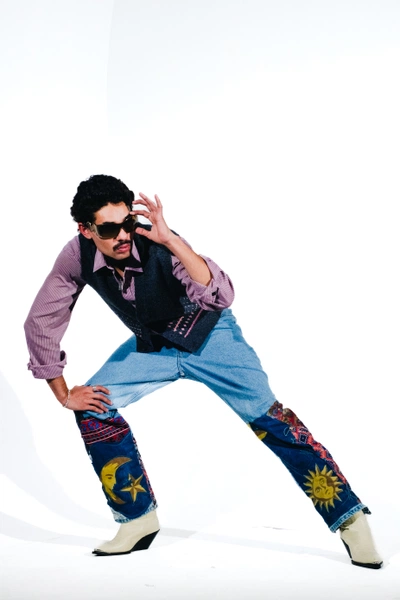 An image added by sethna on Jan 30, 2024. May present: flash photography, gesture, happy, sunglasses, sleeve.