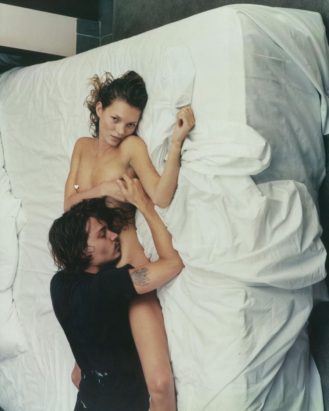 A 1994 portrait of Kate Moss and Johnny Depp at the Royalton Hotel in New York. Photo by Annie Leibovitz.