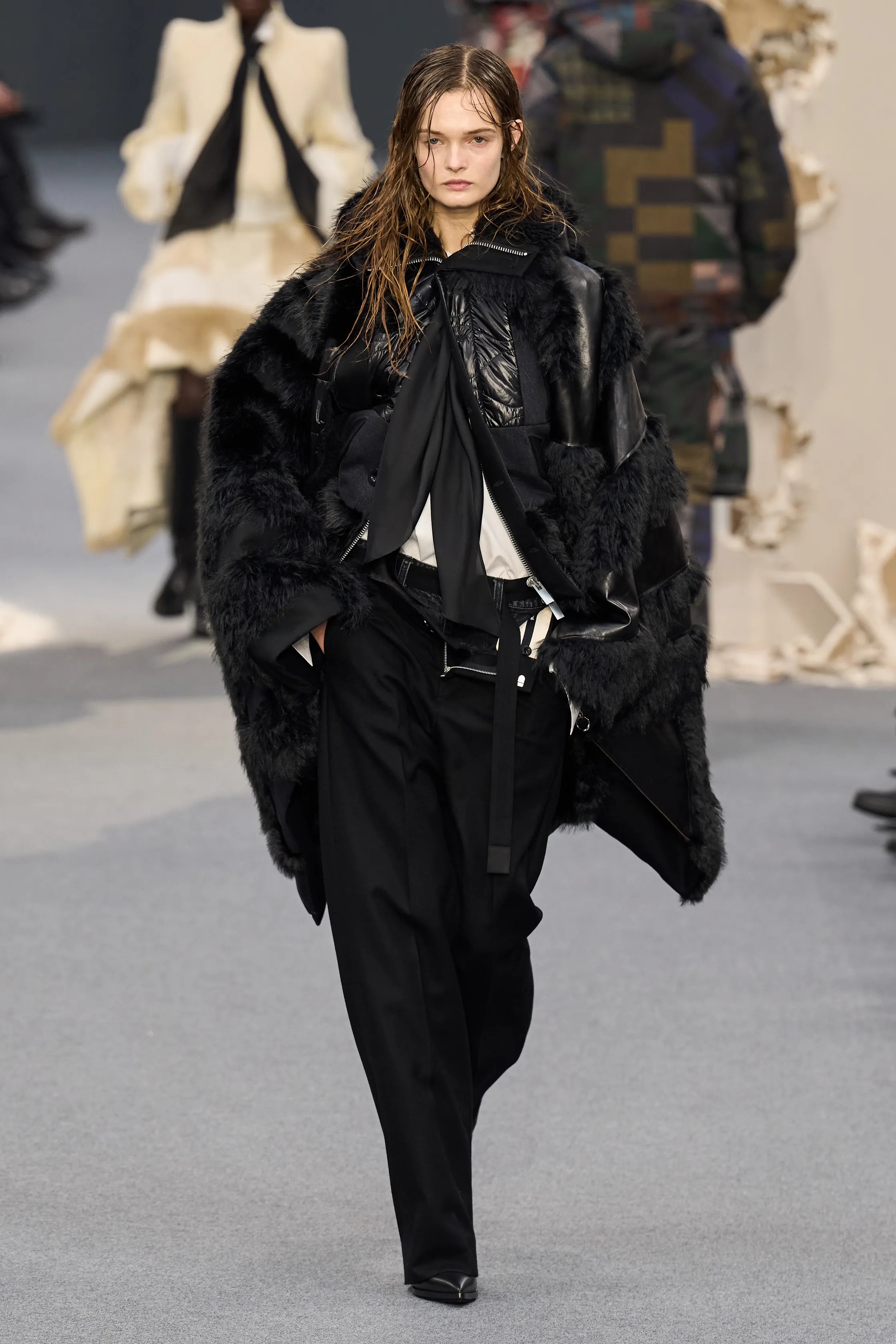 Marylore Heck walks the runway for Sacai's Fall/Winter 2026 collection.