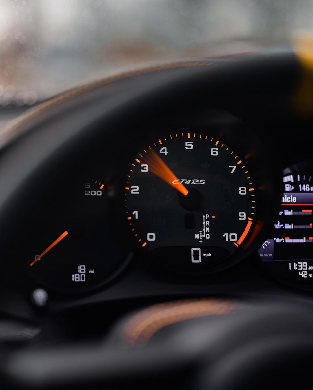 Interior of a 2023 Porsche 718 Cayman GT4 RS in PTS Pastel Orange. Photo by Porsche Exchange.