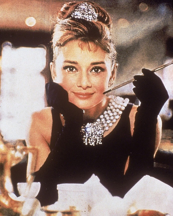 Audrey Hepburn in the iconic black dress designed by Hubert de Givenchy for the 1961 film Breakfast at Tiffany's.