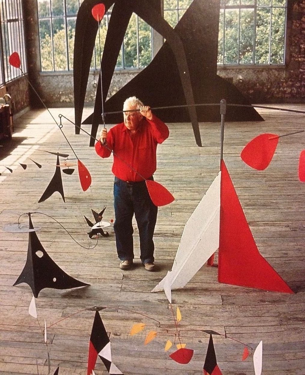 An Instagram  post added by victorroll on Feb 29, 2024. The author is @boleromagazin. May present: 알렉산더 칼더 모빌, alexander calder, calder's flamingo, mobile-stabile, sculpture.