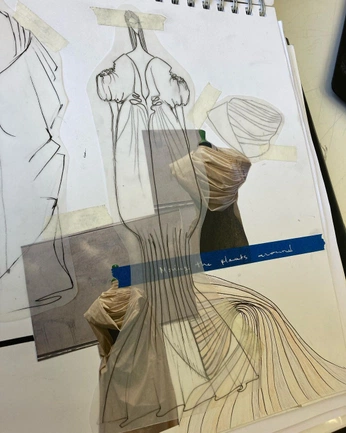 A cover of "FASHION SKETCHBOOK" cluster. The owner is evdokiachristodl. The cluster consists of 12 elements.